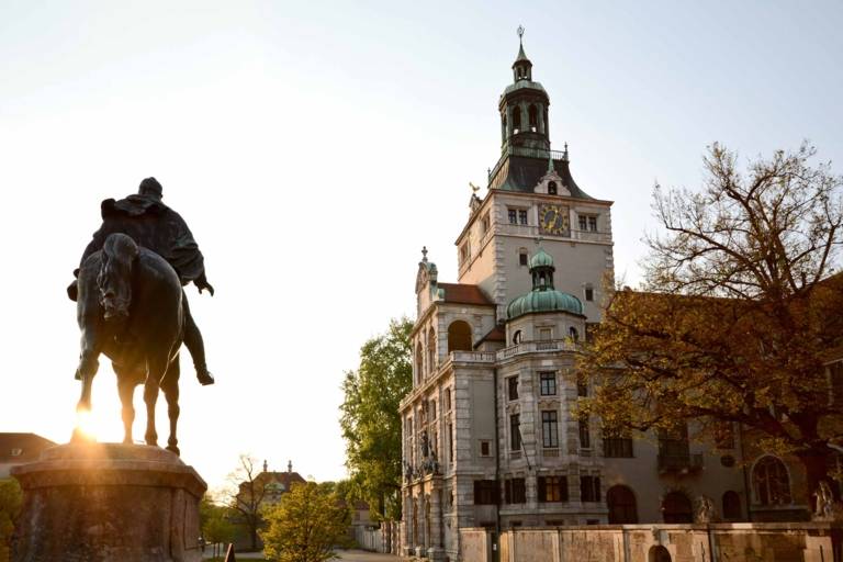 The equestrian statue of Prince Regent Luitpold in front of the Bayerische Nationalmuseum in Munich early in the evening.