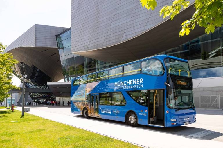 A blue double-decker sightseeing bus at BMW Welt