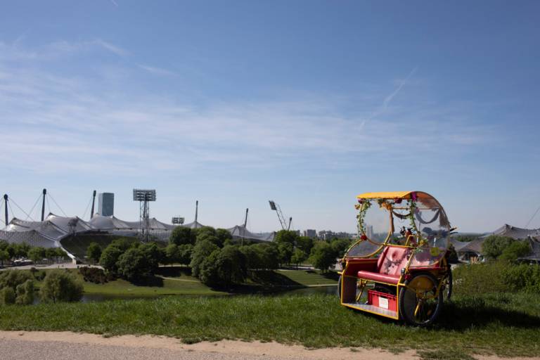 A rickshaw stands on the Olympic Hill in Munich.